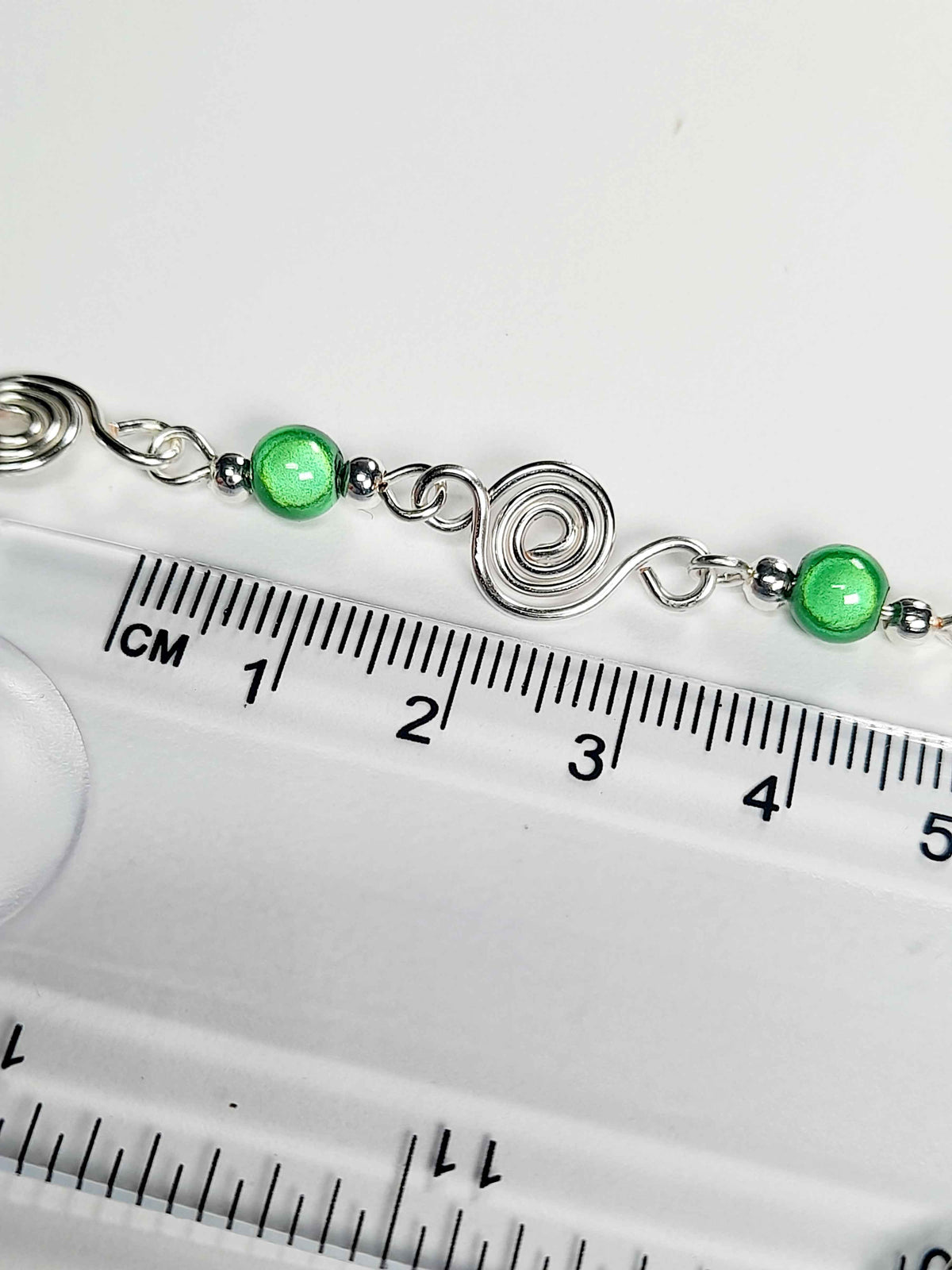 Dainty Silver Spiral Necklace with Green Miracle Beads, Handmade Lightweight Jewellery
