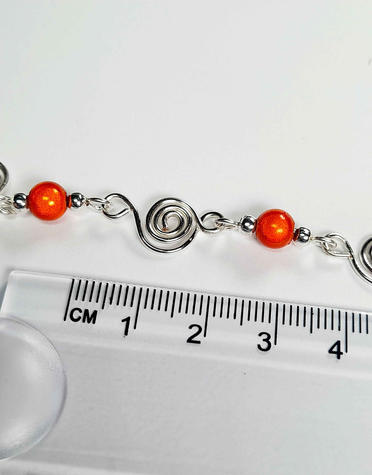 Dainty Silver Spiral Necklace with Orange Miracle Beads, Handmade Lightweight Jewellery
