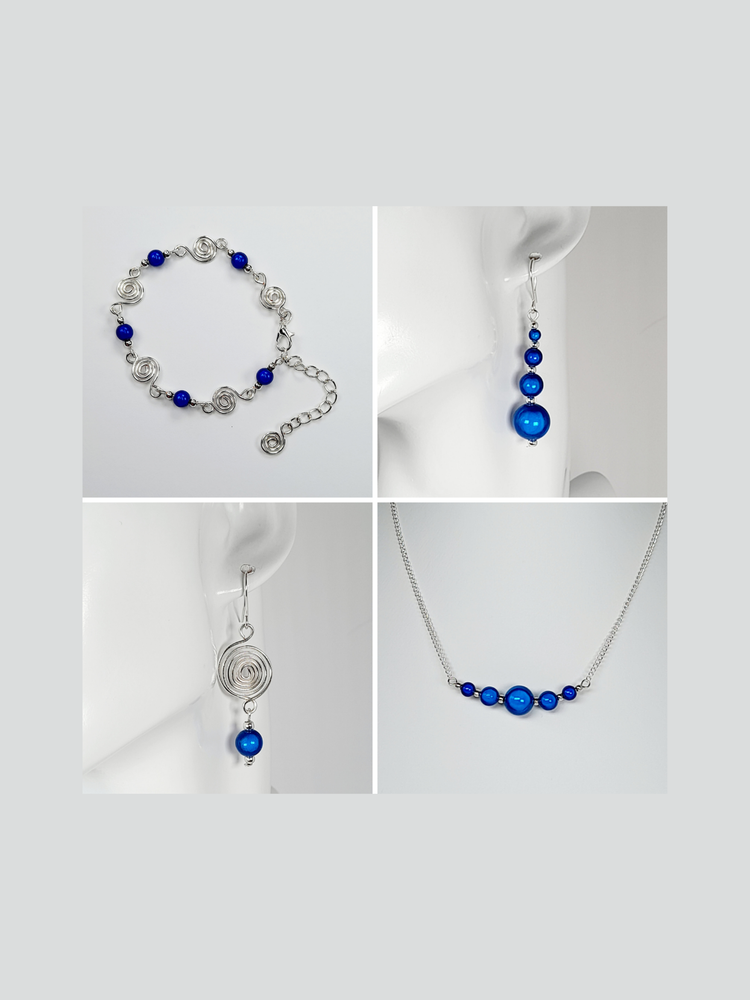 Bright blue miracle bead drop earrings and bead bar necklace with a spiral and bead bracelet and drop earrings.