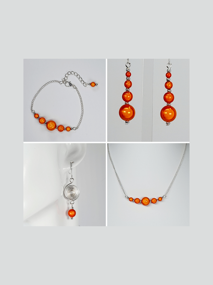 Bright orange miracle beads made into drop earrings, silver bar bead necklace with silver chain, silver bead bar bracelet with silver chain and drop earrings with beads and a handmade silver spiral.