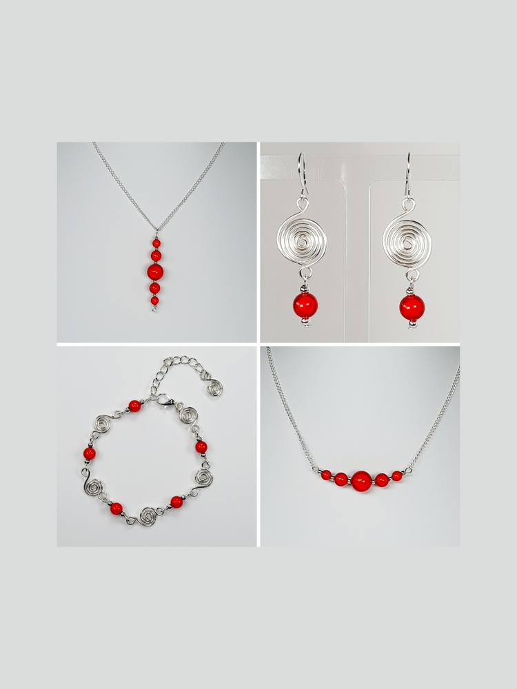 Bright red miracle bead and silver spiral drop earrings and adjustable bracelet, and bright red miracle bead necklace with five beads, finished with silver plated chain.