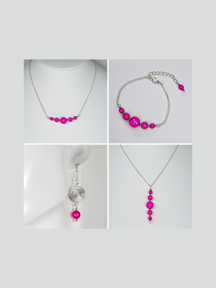 Bright pink miracle beads and silver wire drop spiral earrings, bead bar and chain necklaces and bead bear and chain adjustable bracelet on white background.
