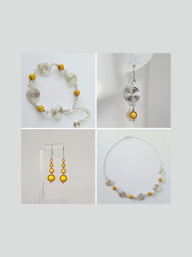 A collage of bright yellow miracle bead and silver spiral earrings, necklaces and bracelets.
