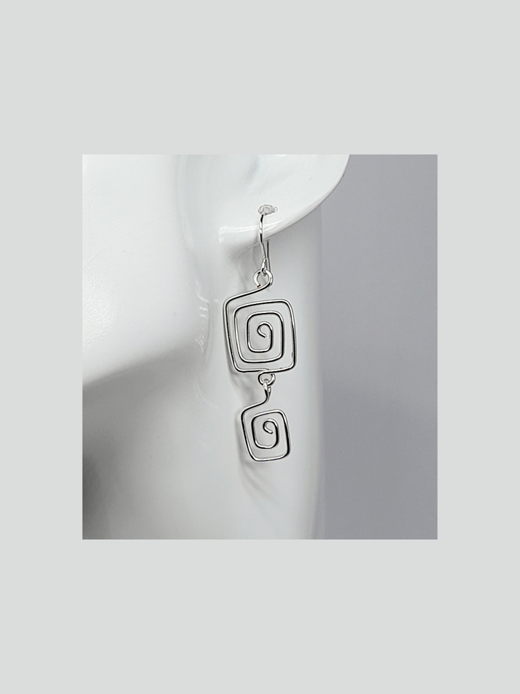 Silver plated drop spiral earrings made with two square spirals hanging on a silver plated ear wire hook.