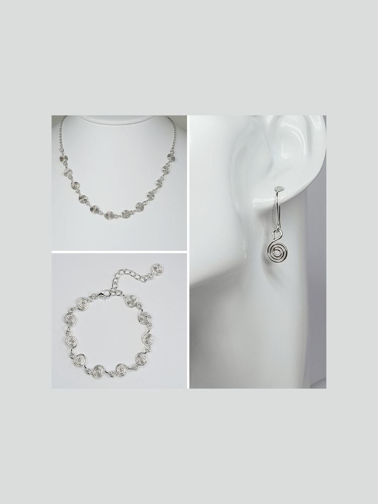 Dainty silver spiral jewellery- drop earrings with tiny silver spiral, necklace made with twelve tiny spirals and silver plated chain and a bracelet made from ten tiny silver spirals. 