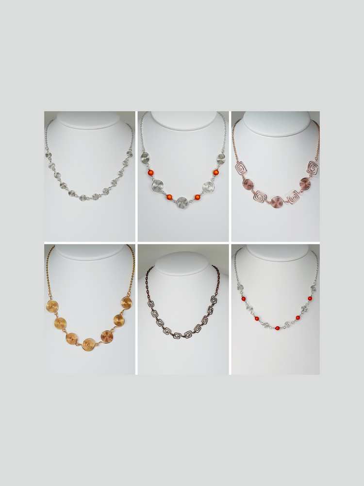 A collage of handmade necklaces made from handcrafted spirals in gold, silver, rose gold and bronze.