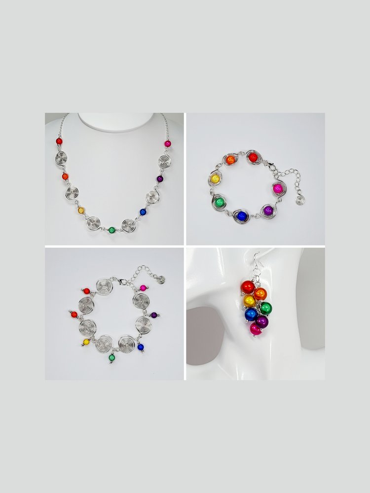 Rainbow necklace and bracelet made from handcrafted silver spirals and bright rainbow coloured miracle beads and a pair of cluster earrings made from rainbow coloured miracle beads.s