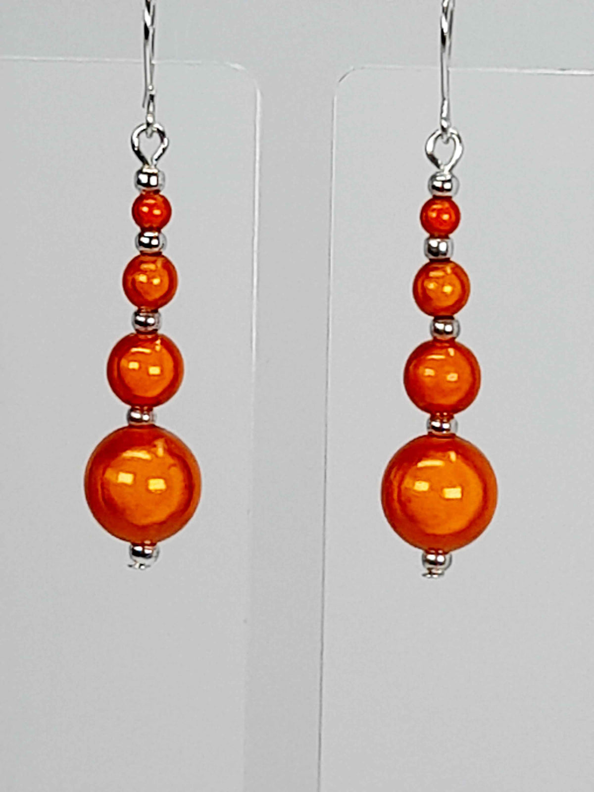 Bright orange miracle bead drop earrings