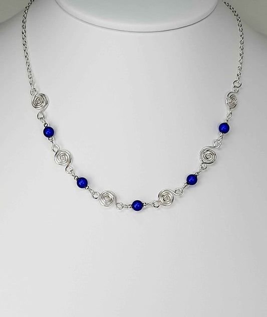 Dainty Silver Spiral Necklace with Blue Miracle Beads,  Handmade Lightweight Jewellery