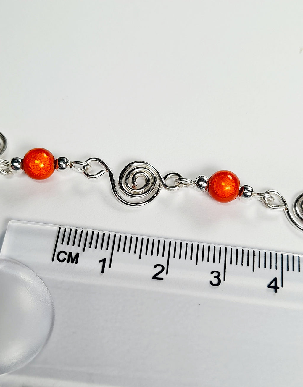 Dainty Silver Spiral Necklace with Orange Miracle Beads,  Handmade Lightweight Jewellery