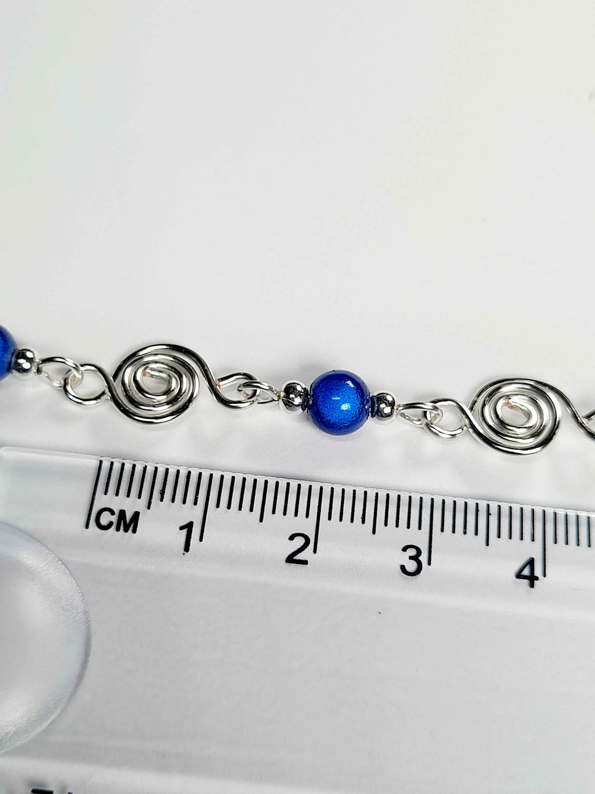 Dainty Silver Spiral Necklace with Blue Miracle Beads,  Handmade Lightweight Jewellery