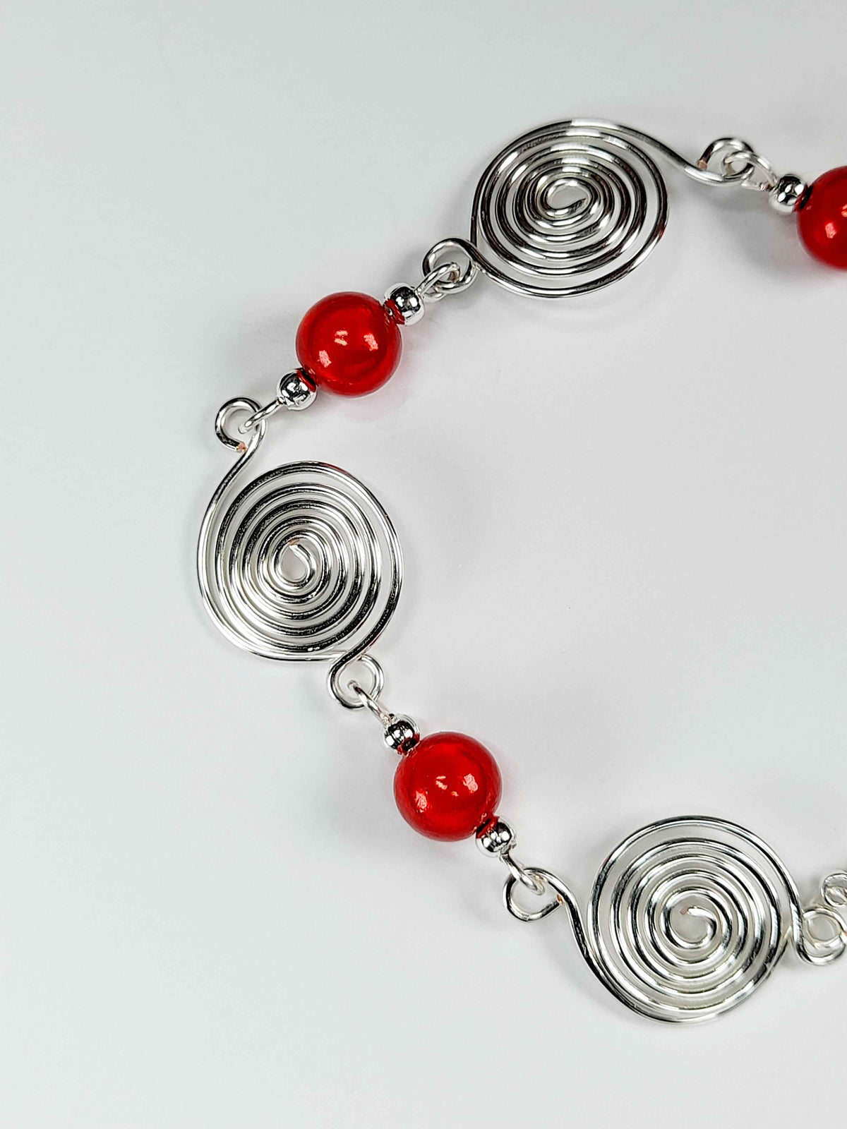 Dainty Silver Spiral & Red Bead Bracelet – Handmade Adjustable Design