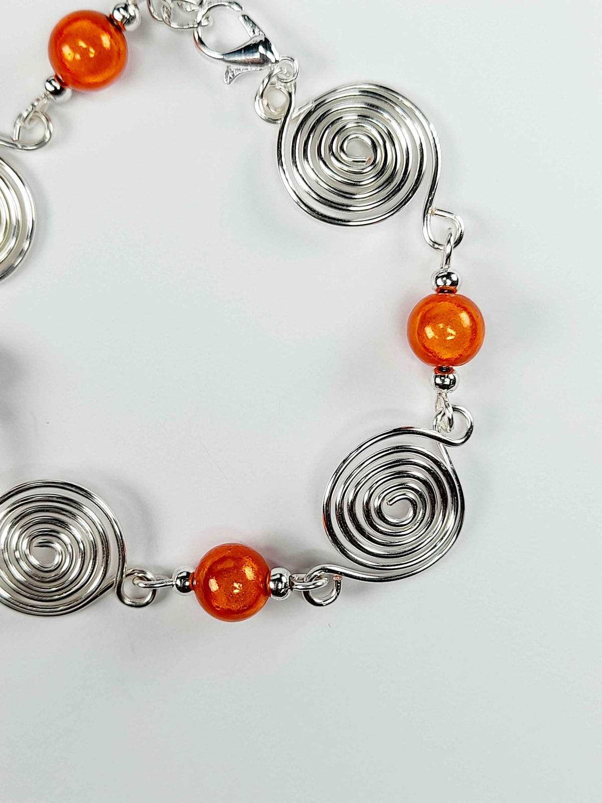 Dainty Silver Spiral & Orange Bead Bracelet – Handmade Adjustable Design