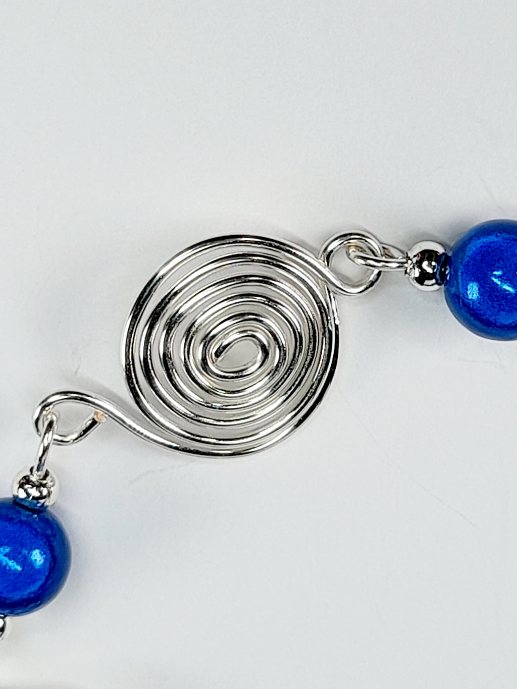Dainty Silver Spiral & Blue Bead Bracelet – Handmade Adjustable Design