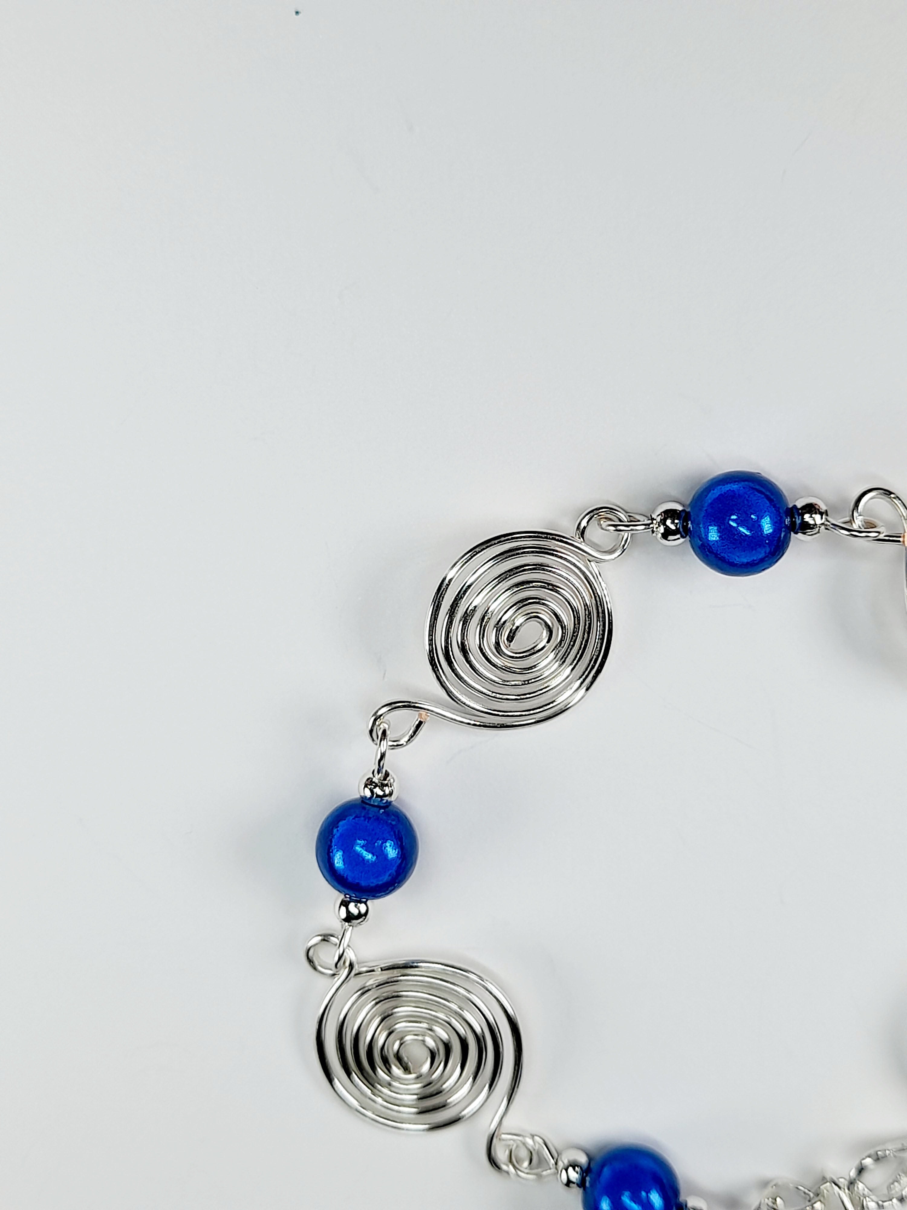 Dainty Silver Spiral & Blue Bead Bracelet – Handmade Adjustable Design