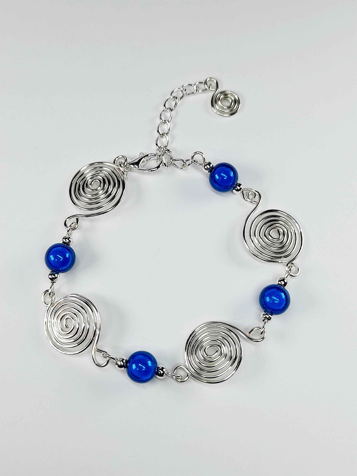 Dainty Silver Spiral & Blue Bead Bracelet – Handmade Adjustable Design