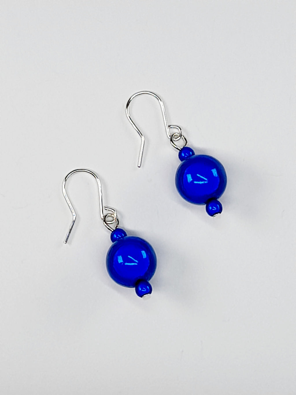 Handmade Silver Dangle Earrings with Blue Luminescent Beads