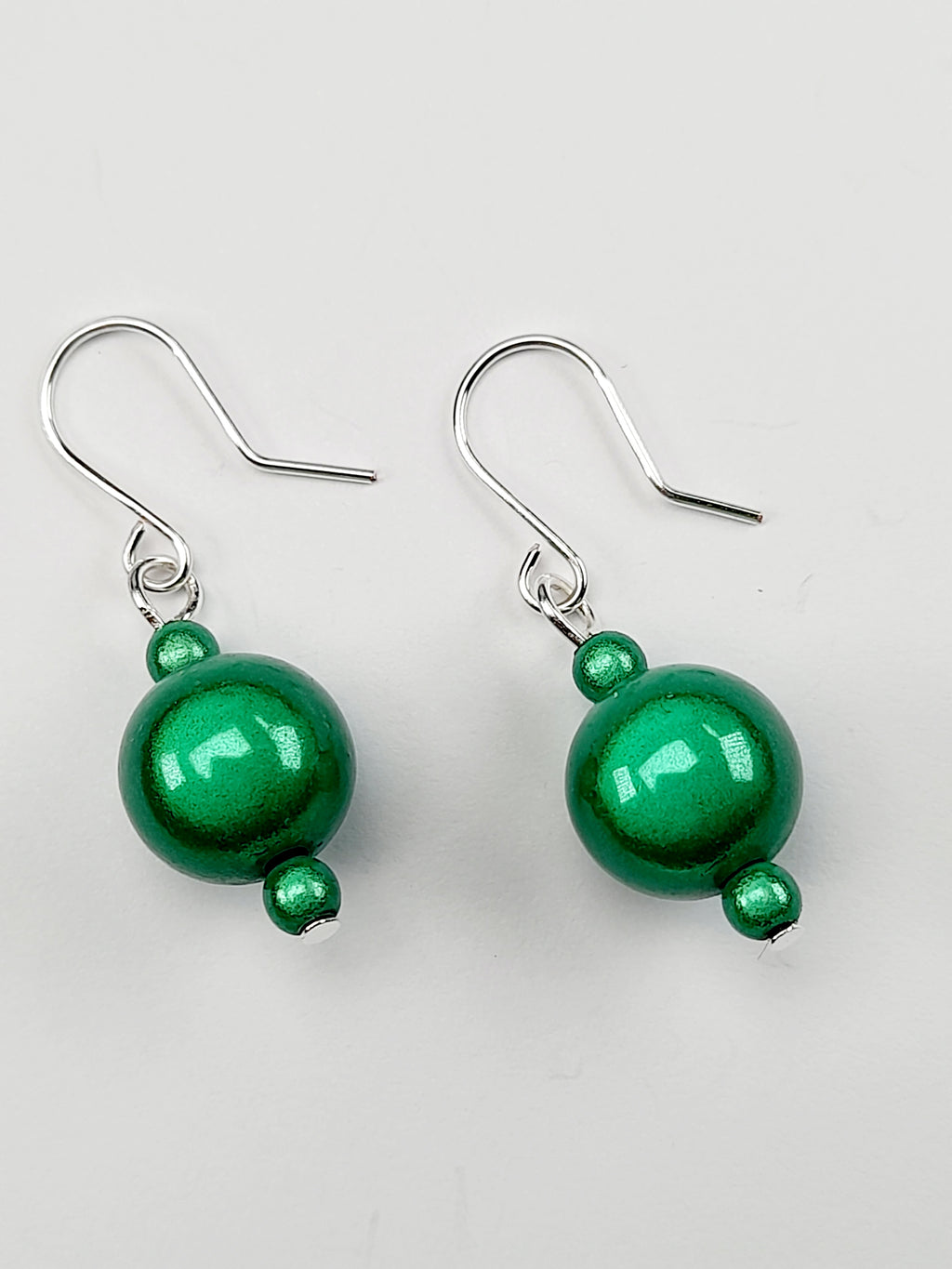 Handmade Silver Dangle Earrings with Green Luminescent Beads