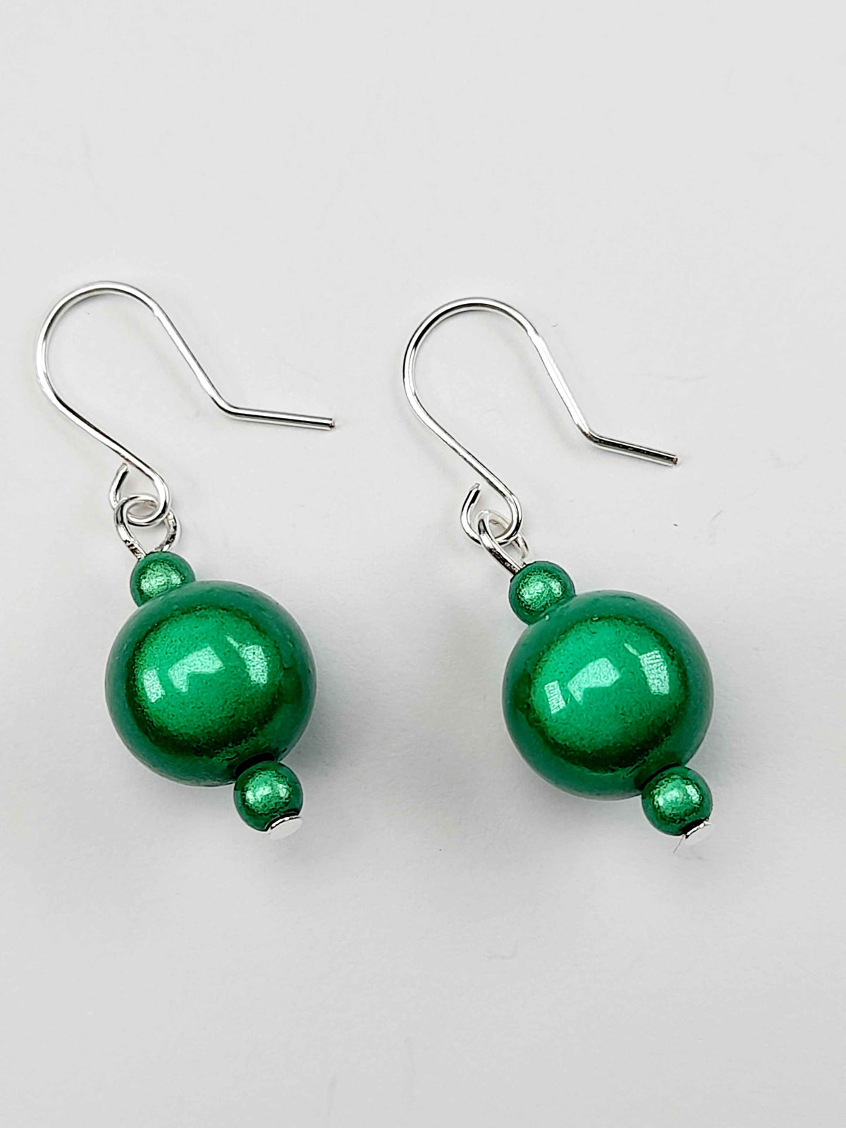 Handmade Silver Dangle Earrings with Green Luminescent Beads