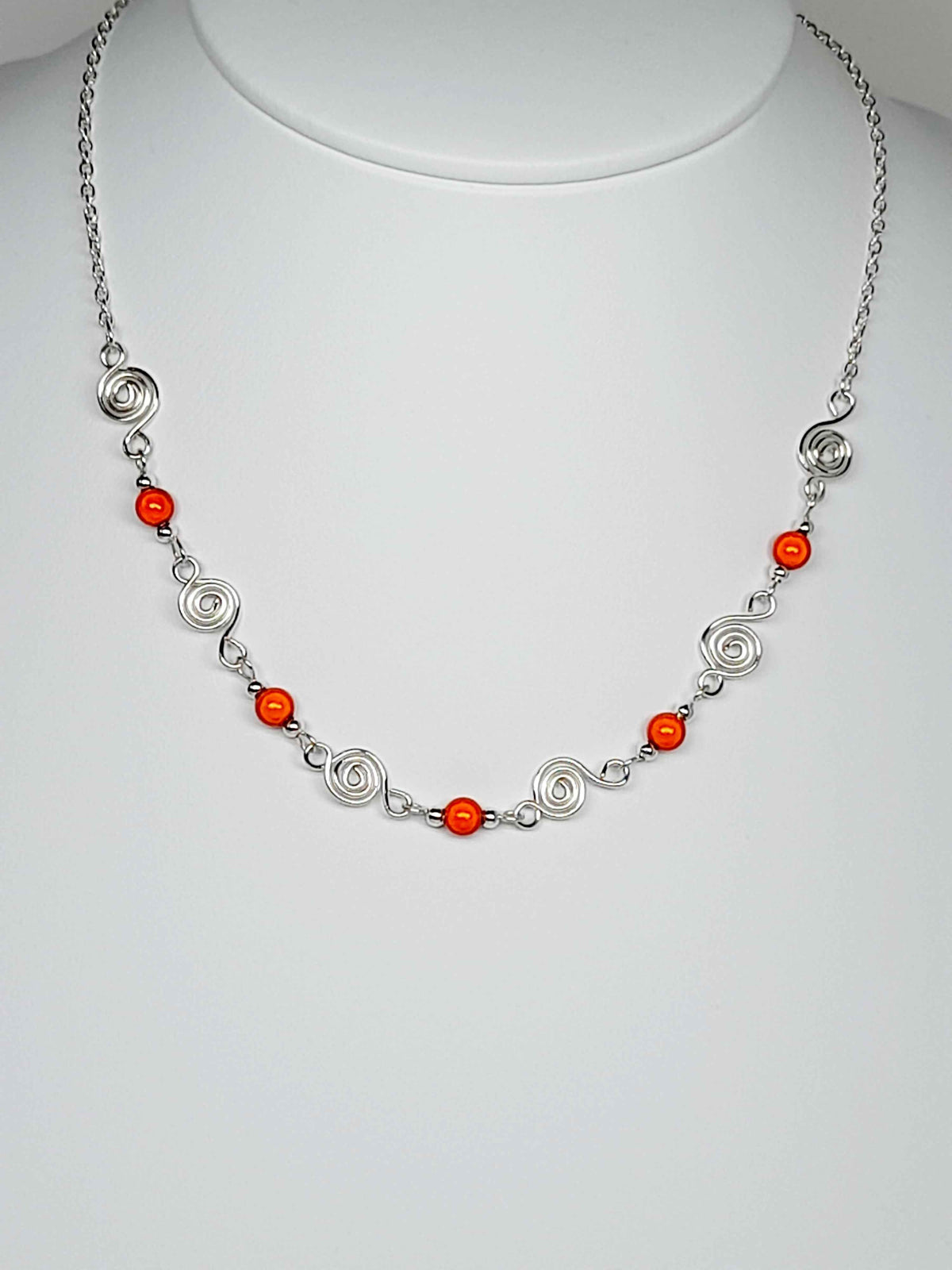 Dainty Silver Spiral Necklace with Orange Miracle Beads,  Handmade Lightweight Jewellery