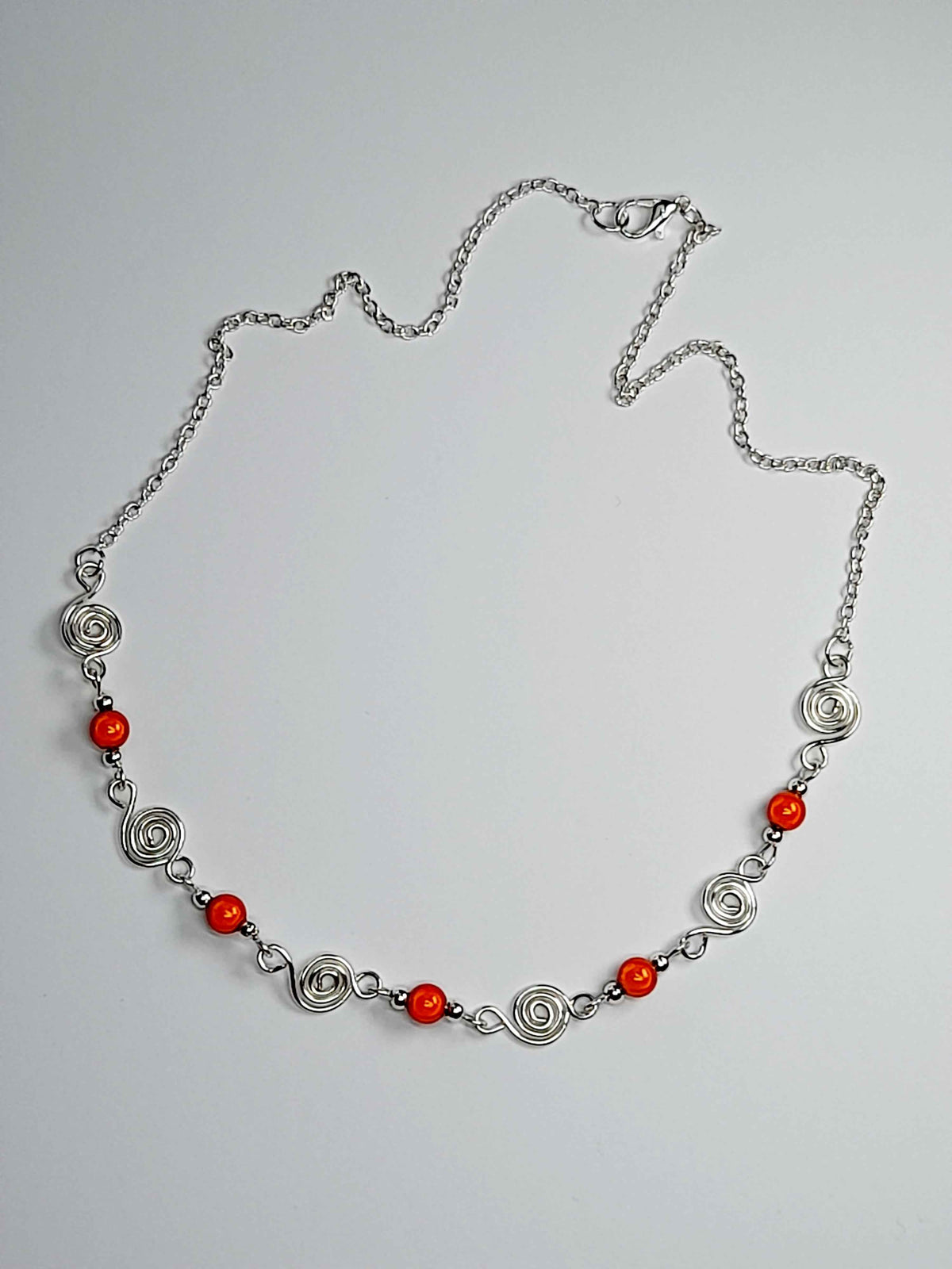 Dainty Silver Spiral Necklace with Orange Miracle Beads,  Handmade Lightweight Jewellery