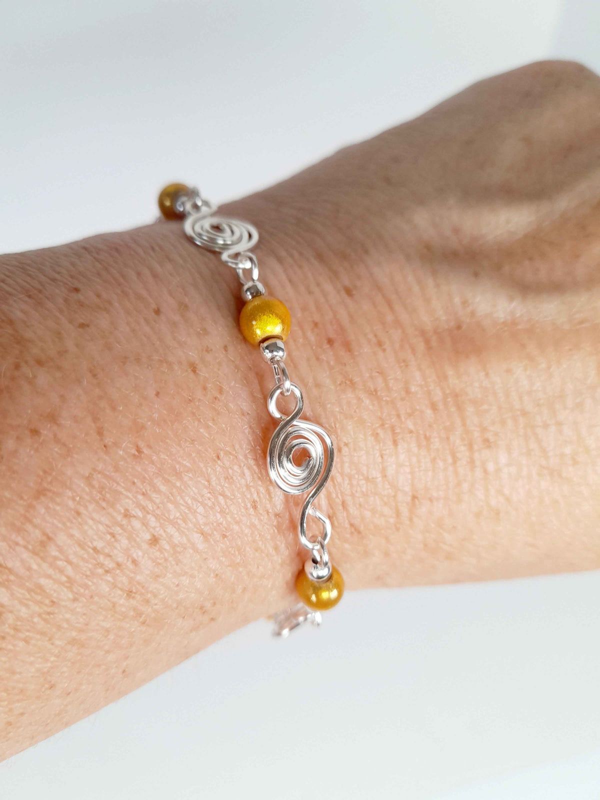 Dainty Silver Spiral & Yellow Bead Bracelet – Handmade Adjustable Design