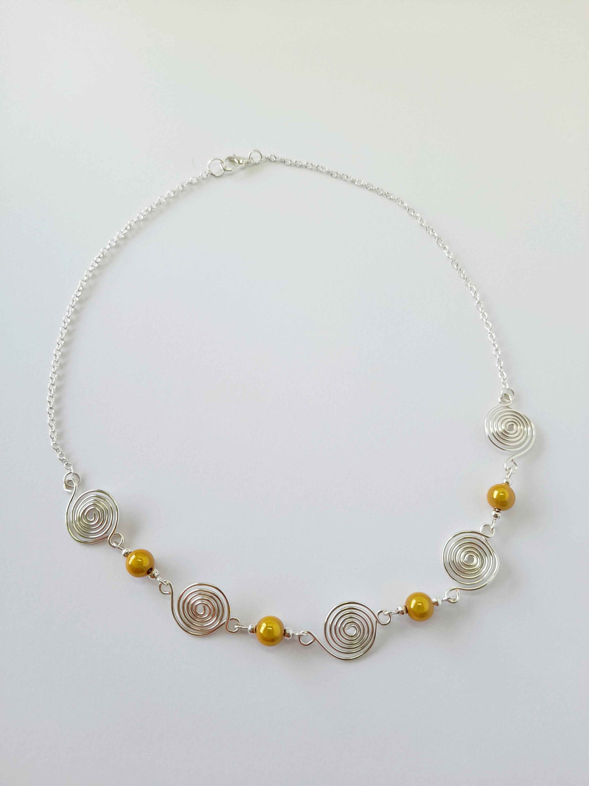 Silver Spiral & Yellow Bead Necklace – Handmade Design