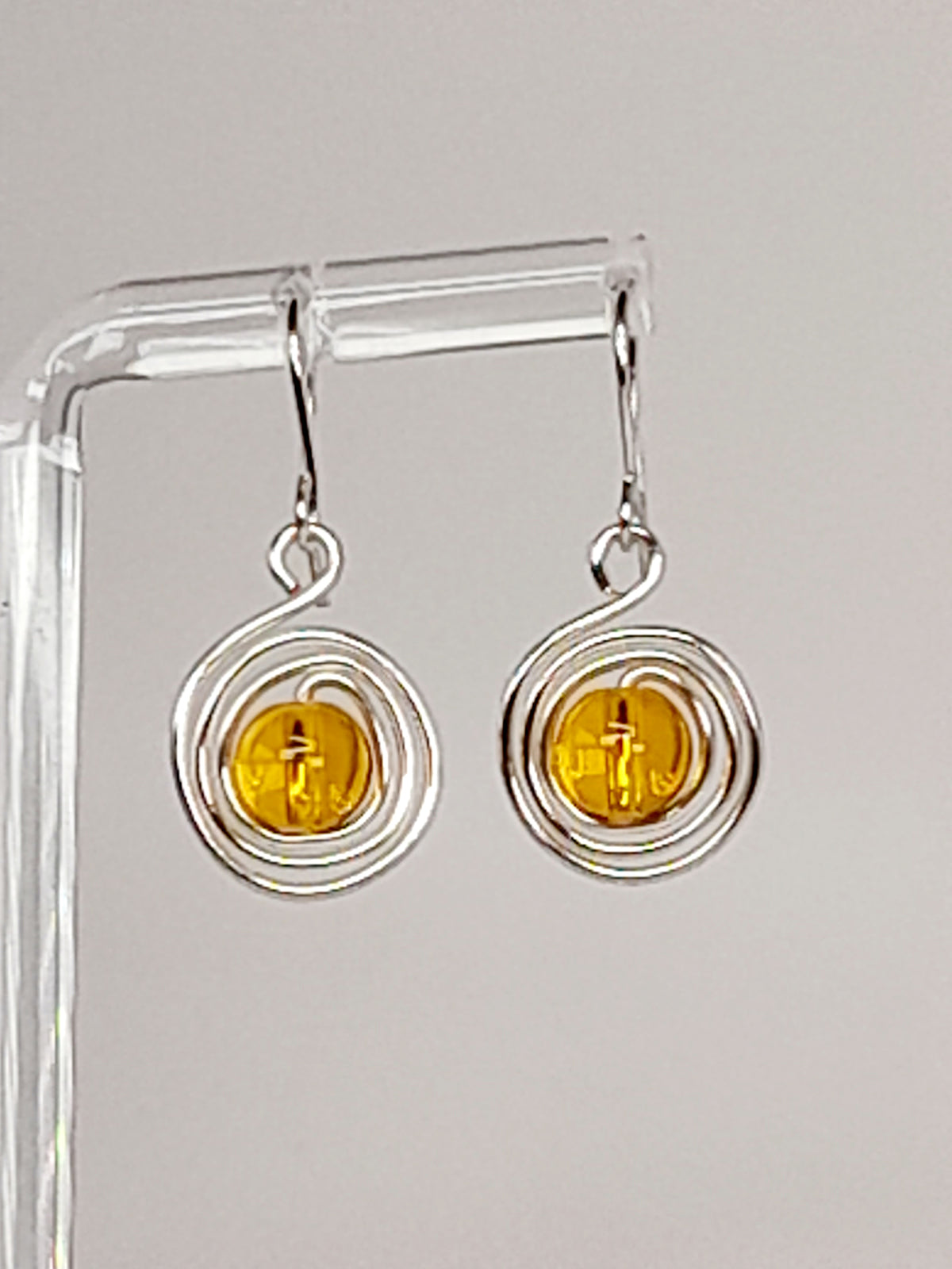 Handmade Silver Swirl Drop Earrings with Yellow Miracle Bead