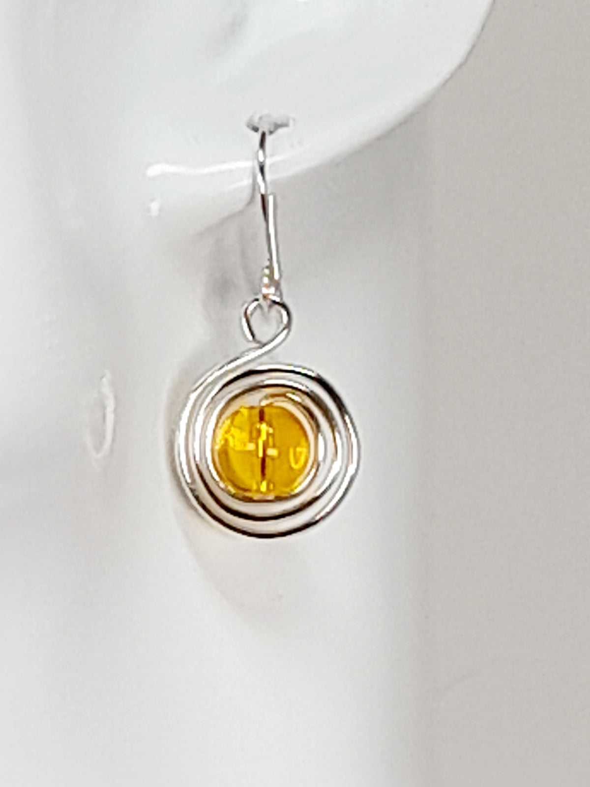 Handmade Silver Swirl Drop Earrings with Yellow Miracle Bead
